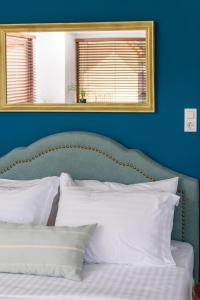 A bed or beds in a room at Acropolis Eye Loft