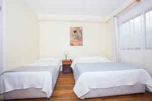 Ένα ή περισσότερα κρεβάτια σε δωμάτιο στο Hotel Santisimo