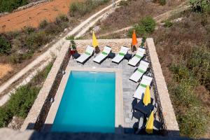 Бассейн в Ajuga Luxury Boutique B&B или поблизости
