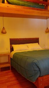 a bed in a room with at B&B Chayana Wasi in Ollantaytambo
