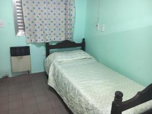 Una cama o camas en una habitación de Gral. Urquiza 780 Departamento Bouchet