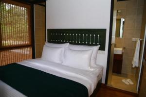 Giường trong phòng chung tại Sennya Resorts