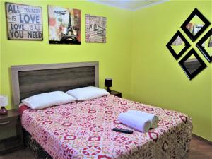 Giường trong phòng chung tại Casa TINY