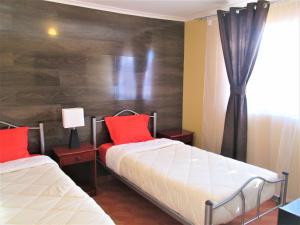 Giường trong phòng chung tại Casa TINY