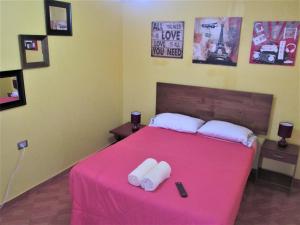 Giường trong phòng chung tại Casa TINY