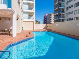 a swimming pool on the side of a building at Oceanic 26 in Forster