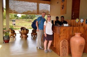a man and a woman standing in front of a counter at Sigiriya King's Resort in Sigiriya +201 photos