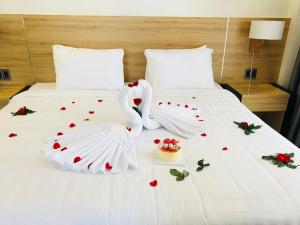 Postel nebo postele na pokoji v ubytování LiLy Apartment