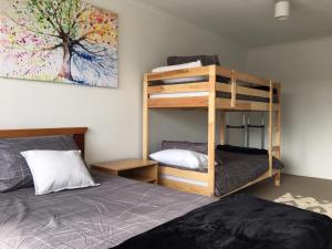 A bunk bed or bunk beds in a room at Windsor Gardens Home