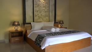 Letto o letti in una camera di Bali Jungle Resort