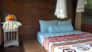 Letto o letti in una camera di Bali Jungle Resort