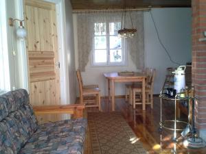 a living room with a couch and a table at Koidu Homestay in Haapsalu