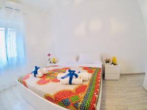 Posteľ alebo postele v izbe v ubytovaní Oudeis Holidays Apartments Tropea