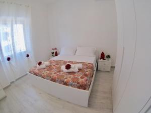 Posteľ alebo postele v izbe v ubytovaní Oudeis Holidays Apartments Tropea