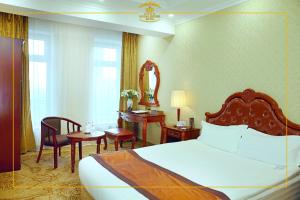 En eller flere senger på et rom på Royal House Hotel 2