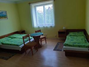 Postel nebo postele na pokoji v ubytování Autocamping Betlanovce