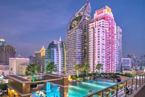 a view of a city skyline with a swimming pool at The Berkeley Hotel Pratunam in Bangkok