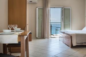 Postel nebo postele na pokoji v ubytování Antonia Hotel