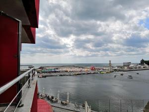 a view of a body of water with boats in it at Hotel Prestige in Costinesti