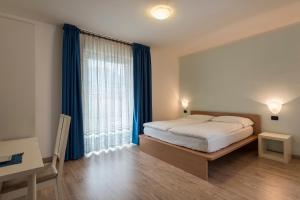 Posteľ alebo postele v izbe v ubytovaní Hotel Villa Al Vento