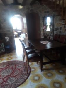 a dining room with a table and chairs at Touch of Spain in Rural France in Darnac