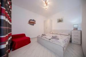 Postel nebo postele na pokoji v ubytování Apartman Marcela
