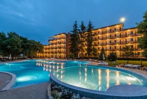 a large swimming pool in front of a building at Belitsa Hotel in Primorsko