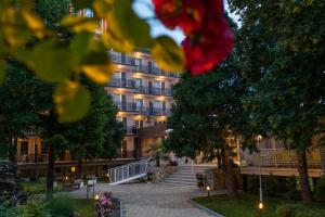 a building with stairs in front of it at Belitsa Hotel in Primorsko