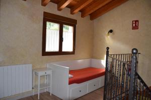 A bed or beds in a room at La Mira
