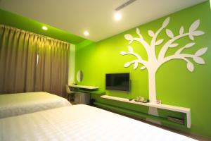 TV a/nebo společenská místnost v ubytování Colorful Homestay