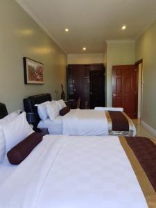 Voodi või voodid majutusasutuse Lae City Hotel toas