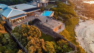 an aerial view of a house with a swimming pool at Pringle Bay Villa in Pringle Bay