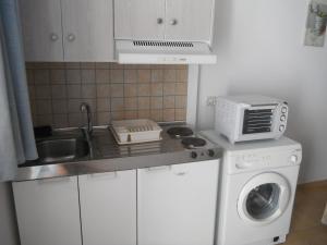 Kuchyň nebo kuchyňský kout v ubytování Mandorla Apartments