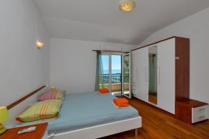 Posteľ alebo postele v izbe v ubytovaní Villa Makar,heated pool,gym,grill,seaview + 29 fotografií