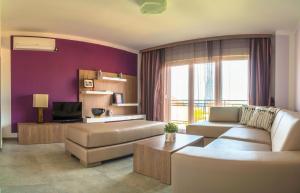 a living room with a couch and a table at Anikol Apartments in Selce