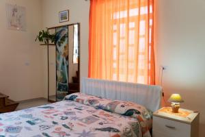 Krevet ili kreveti u jedinici u okviru objekta Casa vacanza “Gelsomino”