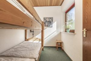 Postel nebo postele na pokoji v ubytování Ostseehaus Petersen