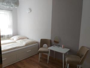 Postel nebo postele na pokoji v ubytování Pokoje gościnne Venezia