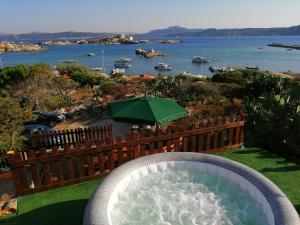 a pool of water with a large swimming pool at B&B Il Corallo in La Maddalena