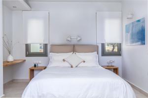 Postel nebo postele na pokoji v ubytování Elios Private Living + 25 fotografií