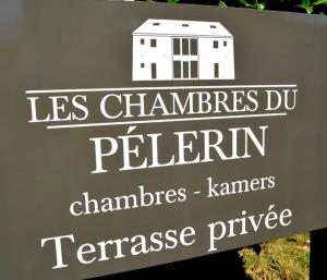 a sign with a building on top of it at La Chambre Du Pèlerin in Foy-Notre-Dame