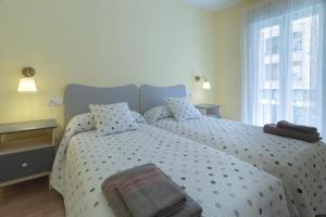 A bed or beds in a room at Río Duero 1