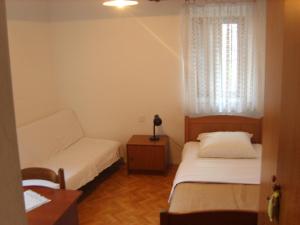 Voodi või voodid majutusasutuse Rooms Roso toas