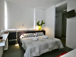 Letto o letti in una camera di Penthouse Sirmione Close The Lake