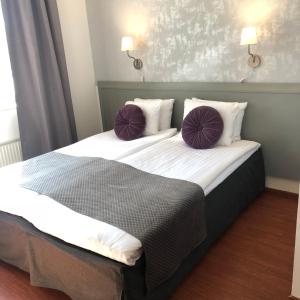 Postel nebo postele na pokoji v ubytování Viktoria Hotell & Konferens