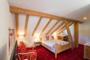 Postel nebo postele na pokoji v ubytování Hotel Sonne Fex Alpine Hideaway