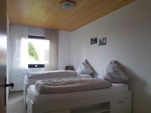 Säng eller sängar i ett rum på Nelkenweg