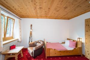 Postel nebo postele na pokoji v ubytování Hotel Sonne Fex Alpine Hideaway