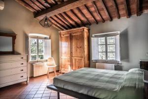 Posteľ alebo postele v izbe v ubytovaní Appartamento con magnifica vista e piscina