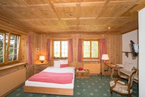 Postel nebo postele na pokoji v ubytování Hotel Sonne Fex Alpine Hideaway